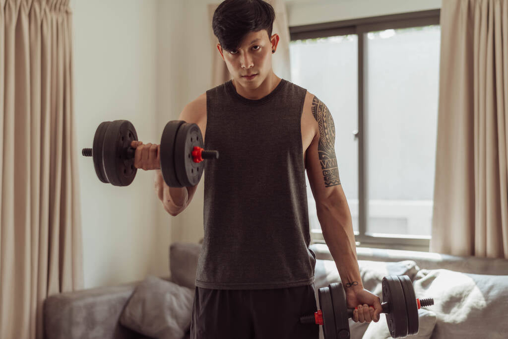 fit man doing arms exercise home young man doing biceps