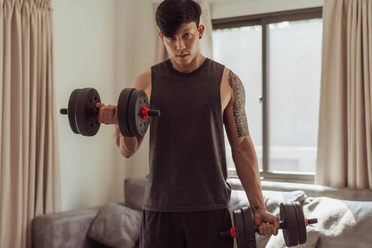 fit man doing arms exercise home young man doing biceps
