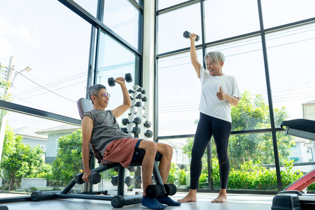 Asian senior woman stand coach guide senior man