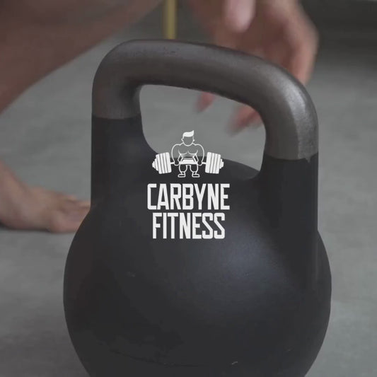 CARBYNE 32KG Adjustable Competition Kettlebell (1kg increments, from 12kg to 32kg) in a fitness setting.